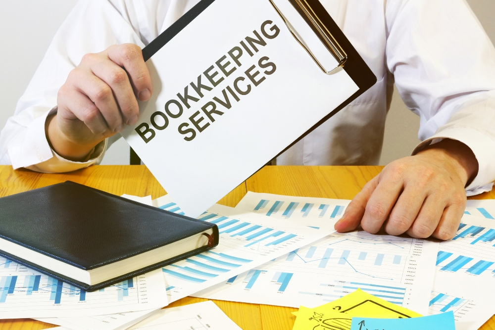 Writing note shows the text of Bookkeeping services to market