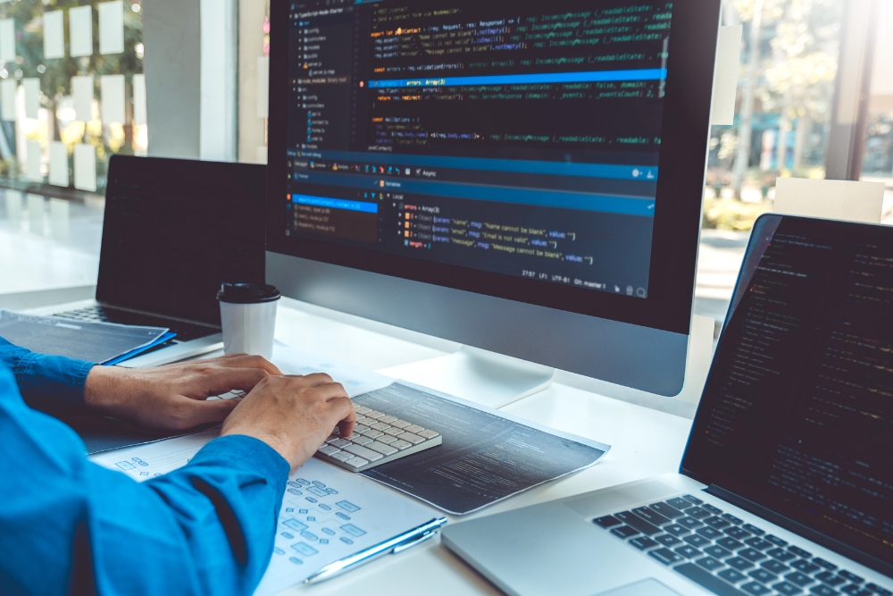 Programmer working in web development design and coding techniques in the software company office. 